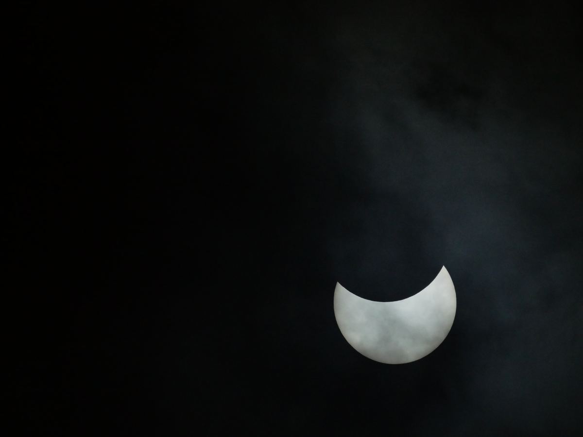 Solar eclipse through clouds