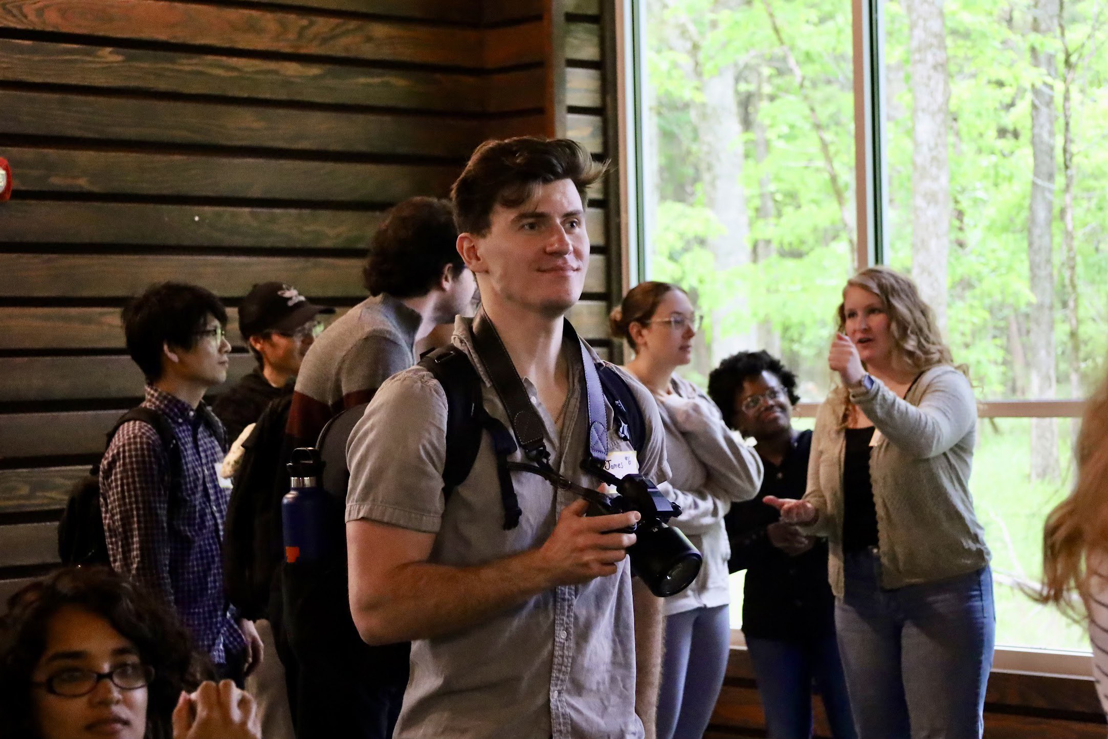 James filming with camera in hand